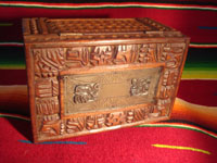 Mexican vintage wood-carving and Mexican vintage folk art, a wooden box beautifully carved with Mayan faces and designs, c. 1930-40. The top of the box bears a silver plaque with wonderful Mayan symbols or faces. Silver plaque and top of the box.