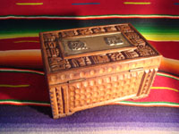 Mexican vintage wood-carving and Mexican vintage folk art, a wooden box beautifully carved with Mayan faces and designs, c. 1930-40. The top of the box bears a silver plaque with wonderful Mayan symbols or faces. Another view of the box.