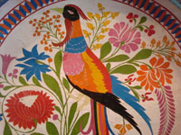 Mexican vintage wood-carving and laquer-ware art, a wonderful batella from Uruapan, Michoacan, c. 1930's. The large batella is decorated with an exquisite exotic bird with a lovely long tail, perhaps the famed quetzal. A closeup of the lovely bird.