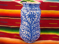 Mexican vintage pottery and ceramics, a Talavera vase from Puebla, c. 1940. Beautiful blue designs of the double-headed Hapsburg eagle, a wonderful plant with a flower, and a beautiful pomegranate (granada). Another side of vase showing a plant with a flower.