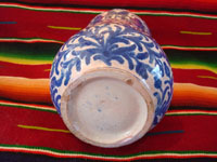 Mexican vintage pottery and ceramics, a Talavera vase from Puebla, c. 1940. Beautiful blue designs of the double-headed Hapsburg eagle, a wonderful plant with a flower, and a beautiful pomegranate (granada). A view of the bottom of the vase.