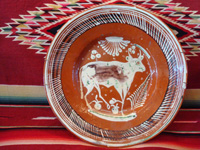 Mexican vintage pottery and ceramics, a bandera-ware charger with a wonderful bull, Tonala or Tlaquepaque, Jalisco, c. 1930's. The charger is decorated with the colors of the Mexican flag (bandera, in Spanish), white, green, and red. Main photo of the charger.