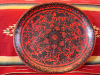 Mexican vintage wood-carving and Mexican vintage folk art, a wooden oval charger from Olinala, Guerrero, laquered and with beautifully incised decorations, c. 1930's. Main photo of Olinala laquer-ware charger.