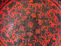 Mexican vintage wood-carving and Mexican vintage folk art, a wooden oval charger from Olinala, Guerrero, laquered and with beautifully incised decorations, c. 1930's. Closeup photo of the incised decorations on the Olinala laquer-ware charger.