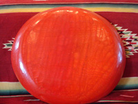 Mexican vintage wood-carving and Mexican vintage folk art, a wooden oval charger from Olinala, Guerrero, laquered and with beautifully incised decorations, c. 1930's. Photo showing the back side of the Olinala laquer-ware charger.