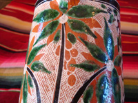 Mexican vintage pottery and ceramics. a lovely petatillo pitcher with a handle and very fine hand-painted decoration, Tlaquepaque, Jalisco, c. 1940's. Photo showing a lovely plant and flower on the pitcher.