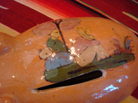 Mexican vintage pottery and ceramics and Mexican vintage folk art, a pottery piggy bank with lovely artwork on its back, from Tlaquepaque, Jalisco, c. 1930's. This is a great piece of Mexican vintage folk art and a collector's dream. Photo showing some of the artwork on the back of the Tonala pottery piggy bank.