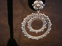 Mexican vintage sterling silver jewelry, a beautiful pair of sterling silver hoop earrings, Guadalajara, c.1940's. Closeup photo of one of the earrings.