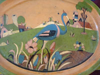 Mexican vintage pottery and ceramics, a pottery oval charger with very fine and detailed artwork, Tonala or Tlaquepaque, Jalisco, c. 1930's.  Another closeup of the front of the oval platter.