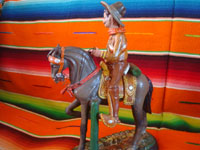 Mexican vintage folk art, and Mexican vintage pottery and ceramics, a pottery sculpture depicting a Mexican revolutionary, perhaps Emiliano Zapata or Pancho Villa, riding a beautiful horse, attributerd to the great Panduro family of sculptors, San Pedro Tlaquepaque, c. 1930's. Photo showing the second side of the horse and rider.