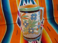 Mexican vintage pottery and ceramics, a beautiful petatillo (cross-hatching in the background, resembling a straw mat or petate, in Spanish) pottery pitcher, with beautiful and intricate decorations, Tonala or San Pedro Tlaquepaque, c. 1930's. Photo showing the second side of the pitcher.