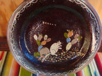 Mexican vintage pottery and ceramics, a beautiful pair of blackware plates with wonderful artwork, Tonala or San Pedro Tlaquepaque, c. 1930's.  Closeup photo of the first plate.