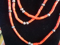 Native American Indian vintage silver jewelry, and Navajo vintage silver jewelry, a beautiful three-strand necklace of wonderful coral with silver beads, Navajo, Arizona or New Mexico, c. 1960's. Closeup photo of a part of the Navajo coral necklace.