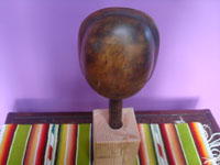 Native American Indian woodcarving and folk art, a beautiful Northwest Coast carved wooden rattle depicting the Bella Colla moon, signed La Valle, c. 1970's.  Photo of the back side of the rattle and stand.