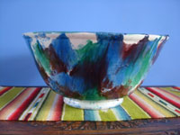 Mexican vintage pottery and ceramics, a beautiful drip-ware pottery bowl with wonderful colors of glaze, Oaxaca, c. 1930's.  A side view of the bowl.
