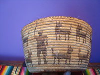 Native American Indian baskets, a beautiful Pima woven pictorial basket showing a man and 19 animals, Arizona, c. 1930's.  Main photo of the basket.