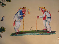 Mexican vintage wood-carving and Mexican vintage folk art, a laquer-ware tray from Olinala, c. 1940's. The tray features two old men with canes in the center, surrounded by flowers and a wonderful red rim. Another closeup of the two old men.