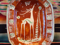 Mexican vintage pottery and ceramics, a lovely oval dish, bandera-ware (the colors of the Mexican flag or bandera), decorated with a graceful deer and cypress tree, Tlaquepaque, c. 1930-40's. Closeup photo of the deer on the front of the plate.