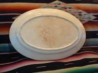 Mexican vintage pottery and ceramics, a beautiful oval platter decorated with a very lovely bird and flowers, Talquepaque, Jalisco, c. 1930-40's. Photo of the back of the platter.
