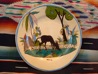 Mexican vintage pottery and ceramics, a lovely plate with a cream-colored background glaze and a wonderful and very serene scene of a burro munching grass under graceful trees and foliage, Tlaquepaque, Jalisco, c. 1930's.  Main photo of the front of the plate.