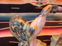 Mexican or Guatemalan vintage pottery and ceramics, a lovely pair of birds, very finely crafted and each with a round fruit in its mouth, Mexico or Guatemala, c. 1930's. Closeup of one of the bird figures.