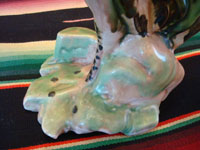 Mexican or Guatemalan vintage pottery and ceramics, a lovely pair of birds, very finely crafted and each with a round fruit in its mouth, Mexico or Guatemala, c. 1930's. Closeup photo of the base of one figure.