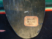 Native American Indian arts and antiques and Northwest Coast Indian arts, a beautiful spoon, made from horn, and incised with an image of a whale, Northwest Coast, Haida people of the Queen Charlotte Islands, British Columbia, c. 1860-80. Closeup photo of the tag on the front of the spoon.