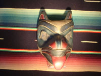 Native American Indian wood-carving and folk art, a Northwest Coast carved wooden miniature mask in the form of a bear with abalone inlaid eyes, signed LAVALLE, c. 1960's. Main photo of the Northwest Coast carved wooden mask.