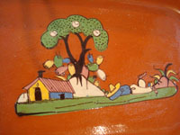 Mexican vintage pottery and ceramics, a beautiful rectangular dish with an earthen-colored (reddish) glaze background and a wonderful rural scene, Tlaquepaque, Jalisco, c. 1940's. Closeup photo of the central design of the dish.