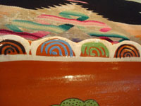 Mexican vintage pottery and ceramics, a beautiful rectangular dish with an earthen-colored (reddish) glaze background and a wonderful rural scene, Tlaquepaque, Jalisco, c. 1940's. Closeup photo showing the border of the dish.