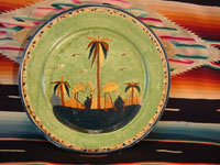 Mexican vintage pottery and ceramics, a wonderful plate with a rare, pale-green background glaze and a beautiful scene with two graceful birds (egrets or cranes), Tlaquepaque, Jalisco, c. 1930's. Main photo.