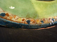 Mexican vintage pottery and ceramics, a wonderful plate with a rare, pale-green background glaze and a beautiful scene with two graceful birds (egrets or cranes), Tlaquepaque, Jalisco, c. 1930's. Closeup of the lovely border of the plate.
