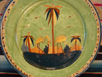 Mexican vintage pottery and ceramics, a wonderful plate with a rare, pale-green background glaze and a beautiful scene with two graceful birds (egrets or cranes), Tlaquepaque, Jalisco, c. 1930's. Another view of the front of the plate.
