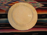 Mexican vintage pottery and ceramics, a wonderful plate with a rare, pale-green background glaze and a beautiful scene with two graceful birds (egrets or cranes), Tlaquepaque, Jalisco, c. 1930's. Photo of the back side of the plate.