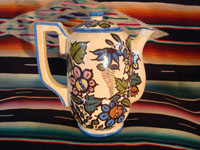 Mexican vintage pottery and ceramics, a beautiful coffee pot with a cream-colored background glaze and exquisite floral decorations, Tlaquepaque, Jalisco, c. 1940's. Main photo.
