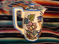 Mexican vintage pottery and ceramics, a beautiful coffee pot with a cream-colored background glaze and exquisite floral decorations, Tlaquepaque, Jalisco, c. 1940's. Another angle of the pot.