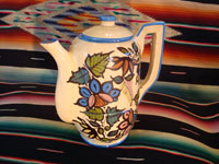 Mexican vintage pottery and ceramics, a beautiful coffee pot with a cream-colored background glaze and exquisite floral decorations, Tlaquepaque, Jalisco, c. 1940's. The second side of the coffee pot.