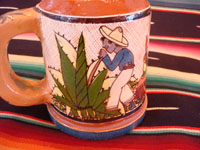 Mexican vintage pottery and ceramics, a set of four mugs with petatillo backgrounds and wonderful artwork, attributed to the famous artist, Balbino Lucano, Tlaquepaque, Jalisco, c. 1930. Closeup photo of one campesino on the Tlaquepaque pottery mugs.