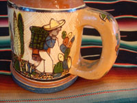 Mexican vintage pottery and ceramics, a set of four mugs with petatillo backgrounds and wonderful artwork, attributed to the famous artist, Balbino Lucano, Tlaquepaque, Jalisco, c. 1930. Photo showing the second campesino on one Tlaquepaque pottery mug.