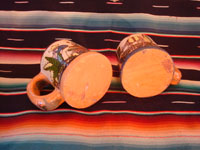 Mexican vintage pottery and ceramics, a set of four mugs with petatillo backgrounds and wonderful artwork, attributed to the famous artist, Balbino Lucano, Tlaquepaque, Jalisco, c. 1930. Photo showing the bottoms of two of the Tlaquepaque pottery mugs.