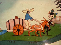 Mexican vintage pottery and ceramics, a spectacular oval tray or charger with handles, a wonderful pale-green background glaze, and very fine artwork, Tlaquepaque, Jalisco, c. 1930's. Closeup photo of the Mexican campesino and his cart.