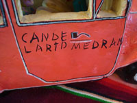 Mexican vintage folk-art, and Mexican vintage pottery and ceramics, a beautiful pottery city bus filled with happy passengers, signed on the side of the bus by the famous, late folk-artist, Candelario Medrano of Santa Cruz de las Huertas, Jalisco, c. 1960's. Photo of the side of the car or bus with the signature of Medrano, the artist.