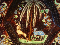 Mexican vintage pottery and ceramics, a stunning pottery bowl with a beautiful black background and a starry night pattern, and highly intricate artwork decorations, Tonala or San Pedro Tlaquepaque, c. 1920-30's. Closeup photo of the animals and trees decorating the front of the bowl.