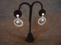 Native American Indian vintage silver jewelry, and Navajo silver jewelry, a beautiful pair of dangling hoop earrings with a lovely turquoise stone, Arizona or New Mexico, c. 1940's. Main photo of the pair of Navajo silver jewelry earrings.