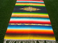 Mexican vintage textiles and Saltillo serapes (sarapes), a very beautiful Saltillo serape with a rainbow colored background and wonderful, bright colors, Saltillo, Coahuilla, c. 1940. Photo showing one edge of the serape.