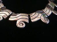 Mexican vintage sterling silver jewelry, and Taxco vintage sterling silver jewelry, a beautiful silver necklace and earrings set, Taxco, c. 1940's. Closeup photo of a part of the Taxco silver necklace.