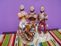 Mexican vintage folk art, a pottery sculpture of three men with a playful devil in front (possibly representing the Trinity of Father, Son, and Holy Spirit), Ocumicho, Michoacan, c. 1950's. Main photo of the sculpture.
