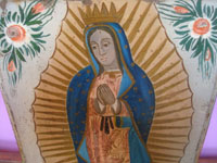 Mexican vintage devotional art, a wonderful retablo depicting Our Lady of Guadalupe, painted on tin, Mexico, c. 1930's. Closeup photo of Our Lady's face.