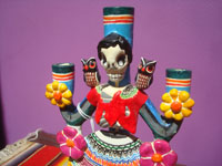 Mexican vintage folk art, a wonderful pair of pottery Day of the Dead candleholders by the famous late artist Alfonso Castillo, c. 1980. Closeup photo of the China Poblana.