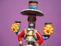 Mexican vintage folk art, a wonderful pair of pottery Day of the Dead candleholders by the famous late artist Alfonso Castillo, c. 1980. Closeup photo of the charro.